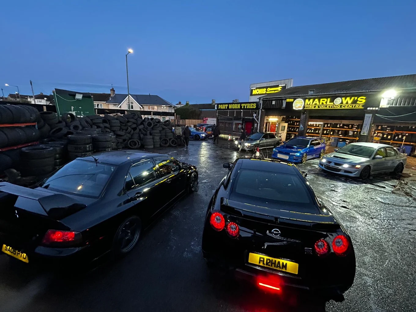 Marlow's Street Car Wash shop front lit up at night in Walsall